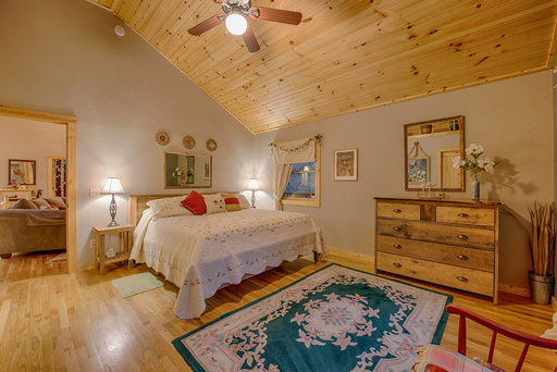 Bedroom one with private bathroom in Mountain Creek Cabin in Maggie Valley, NC