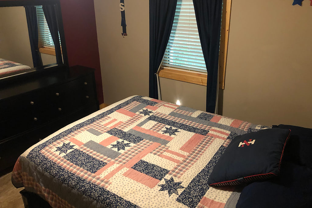 Lower level living bedroom 3 in Mountain Creek Cabin in Maggie Valley, NC